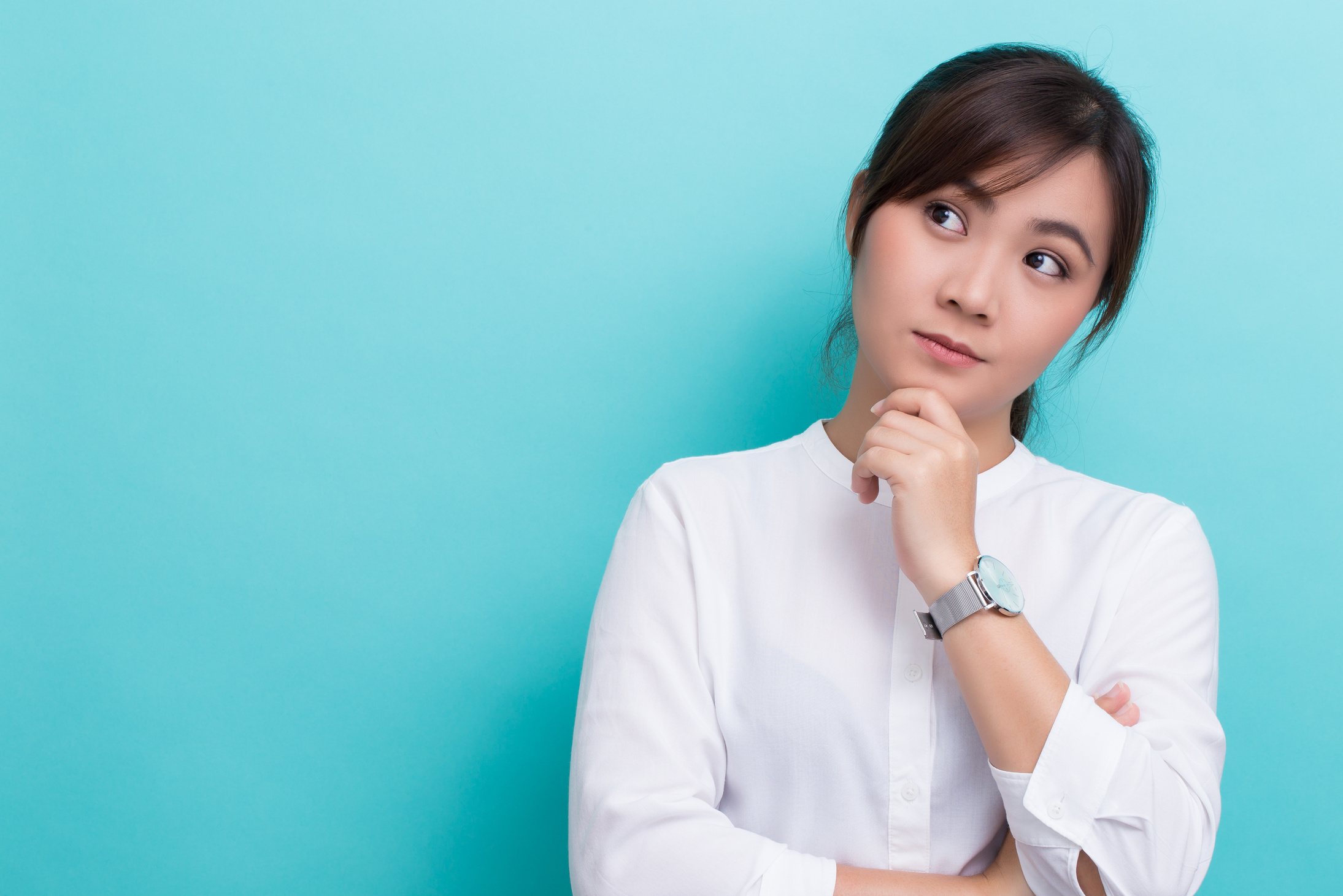 Asian woman thinking on isolated background